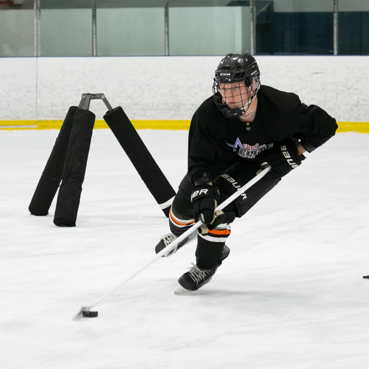 Euro Elite Hockey player developing puck control and edge work on the ice