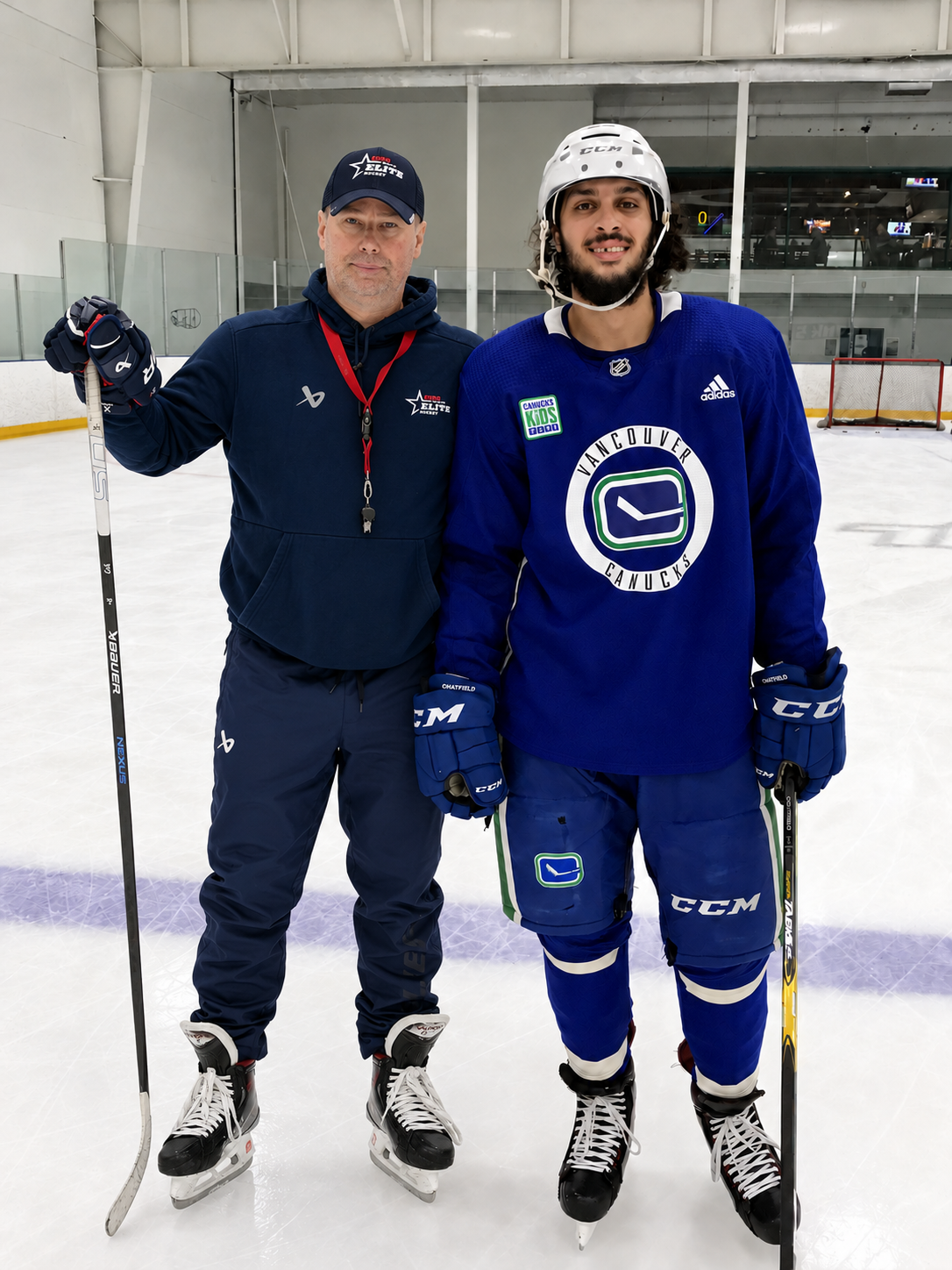 Guido Lamberti-Charles with Jalen Chatfield on the ice