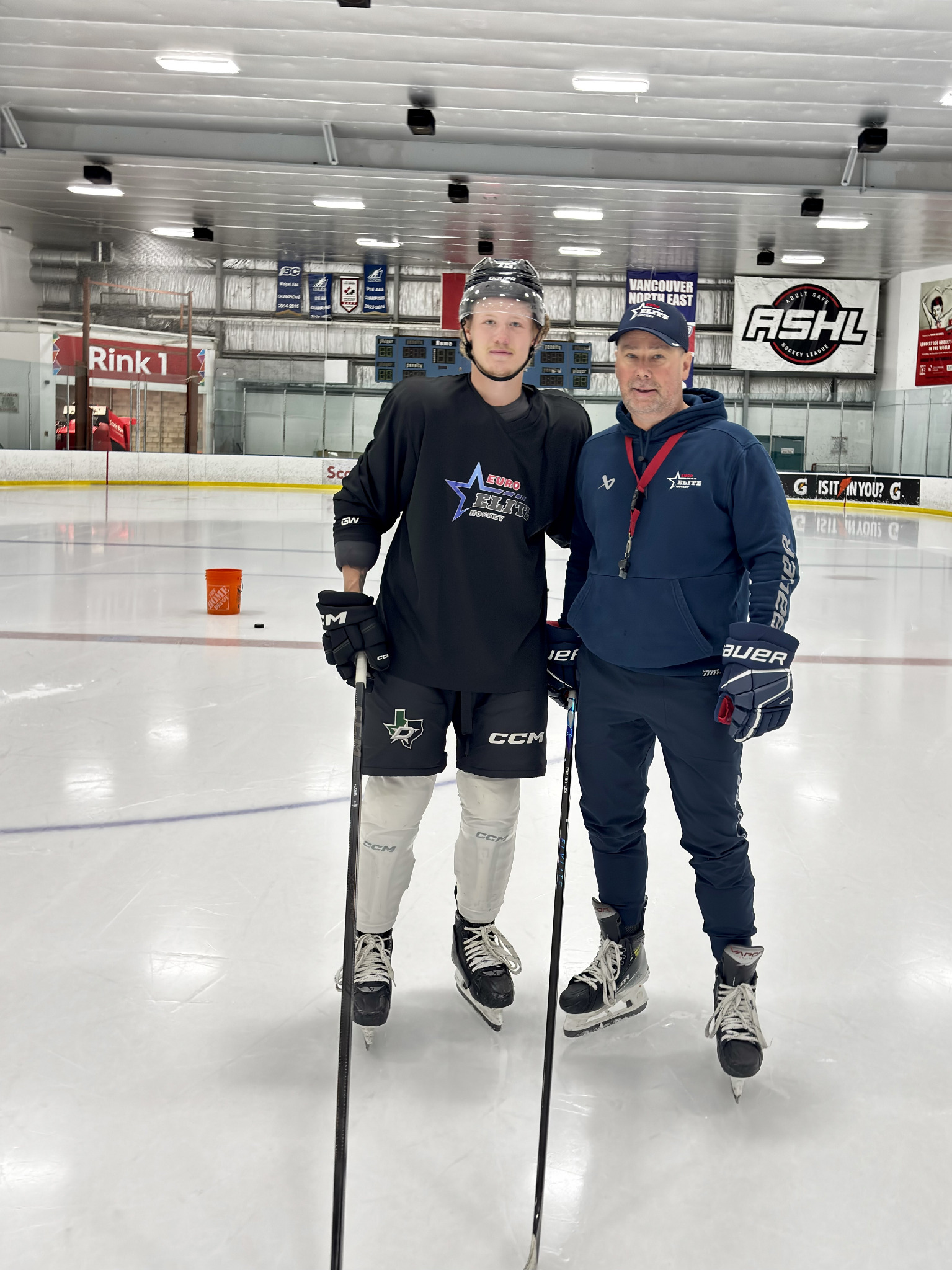 Guido Lamberti-Charles with Jaxon Fuder on the ice